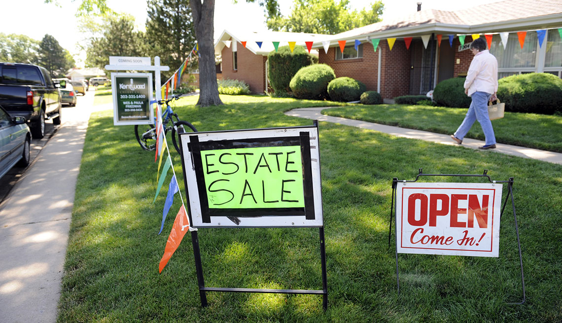 Signs For An Estate Sale On A Yard Outside Home, AARP Home And Family, Queen Of Clutter